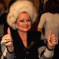 tammy faye thumbs up