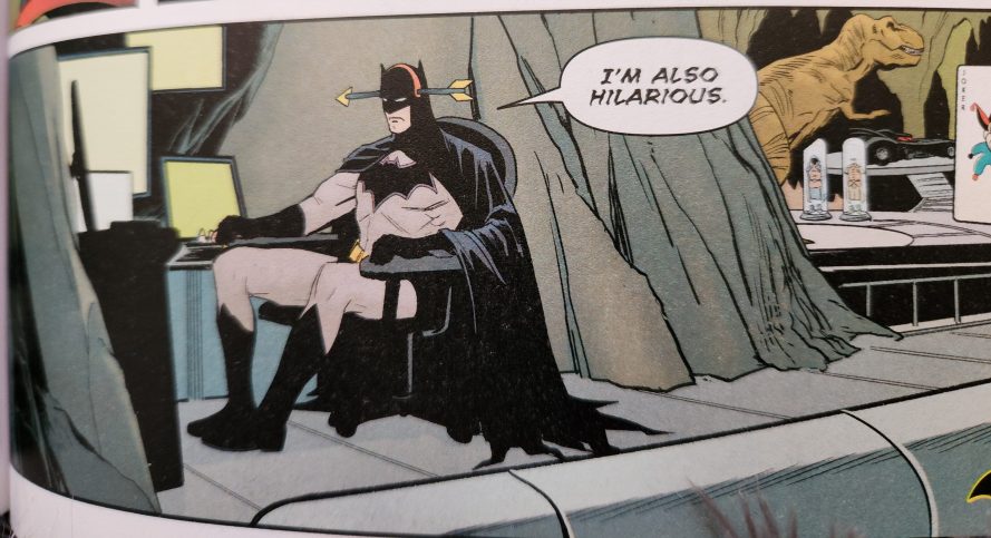 Batman sits before the Bat computer in the Bat Cave. He wears a novelty head band that makes it look like there is an arrow through his head. He says, in grim lettering, "I'm also hilarious."